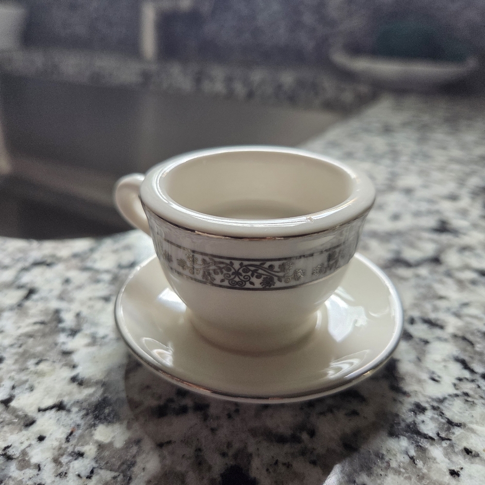 Elegant Cream and Silver Teacup with Saucer